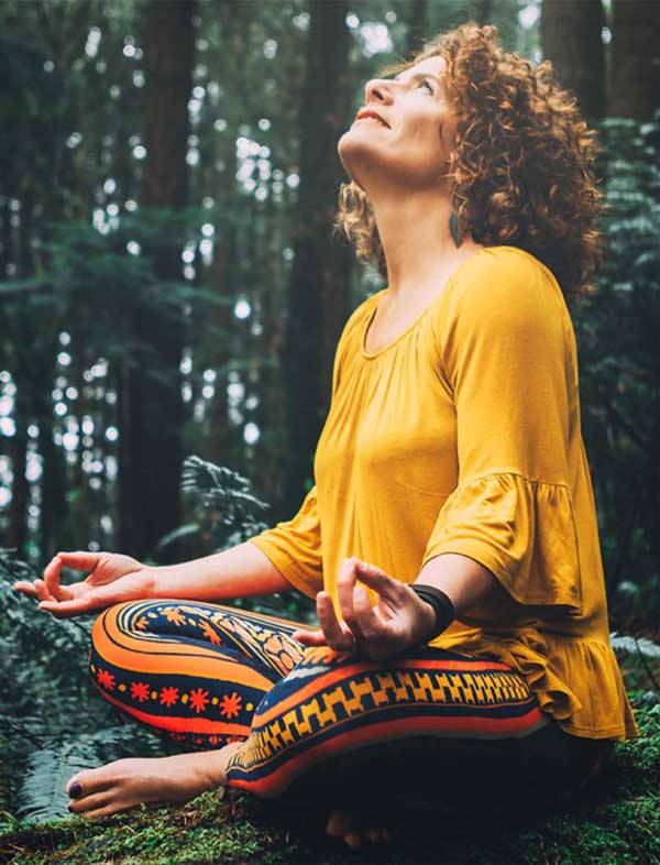 Pam Blair of Yoga Bug Real Estate takes some time to meditate in the forest